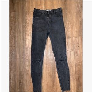 Faded ripped in the knee black jeans